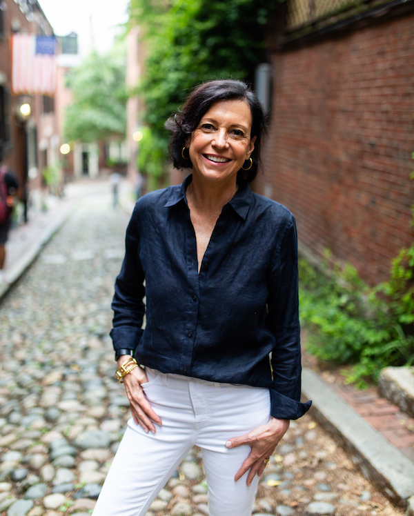 Jenn Redmond standing in a cobble stone street